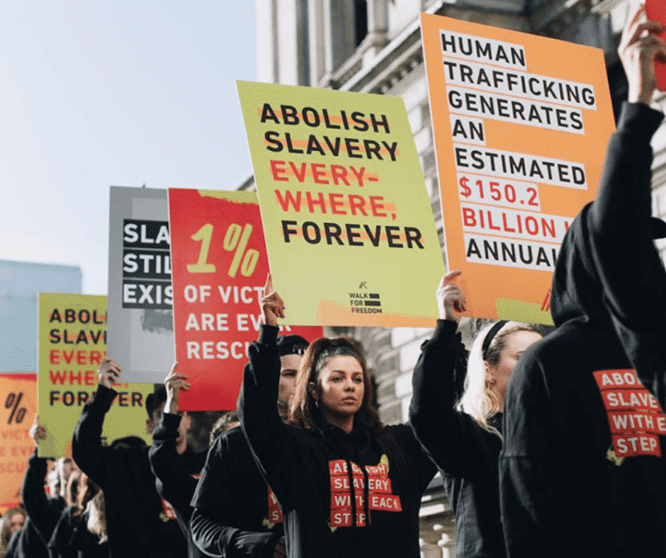 a group of people holding signs