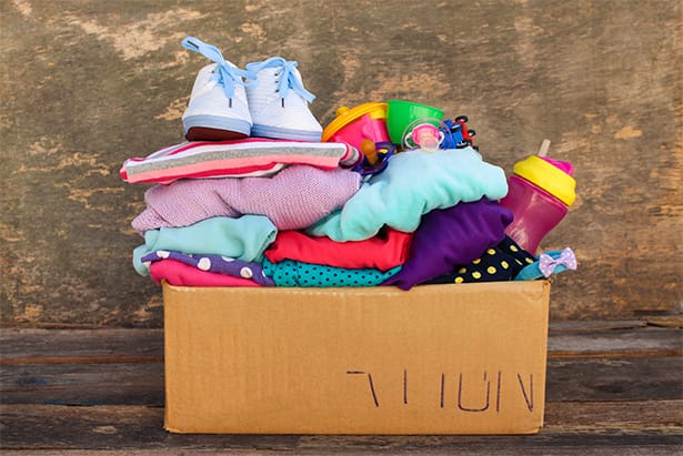 a box full of clothes and baby shoes